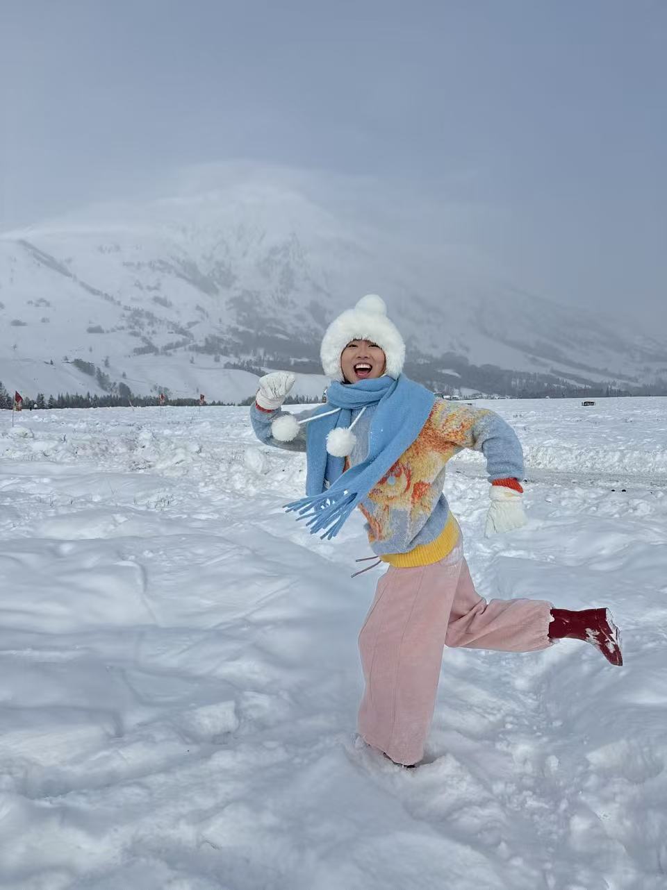 Tutu standing in a snowy mountain landscape